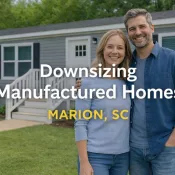Smiling couple in front of home AMHO